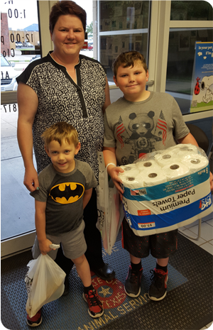 Photo of family donating to shelter