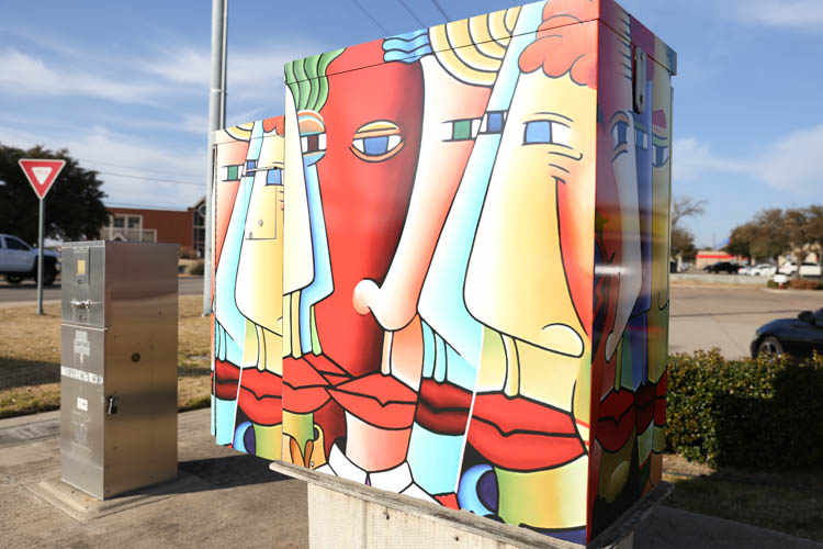 Colorful interpretive faces utility box artwork design