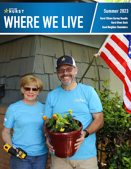 Councilmembers Cathy Brotherton and John Miller pose in front of a home smiling and holding a potted plant that they gave to the homeowner. This is the cover of our Summer 2023 magazine.