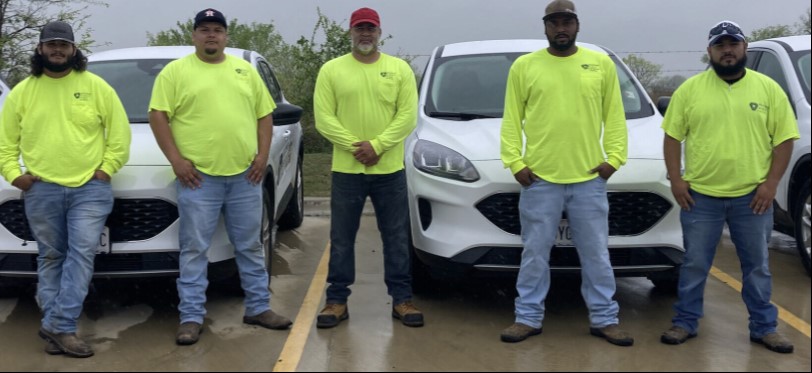 ameresco crew standing together in neon shirts